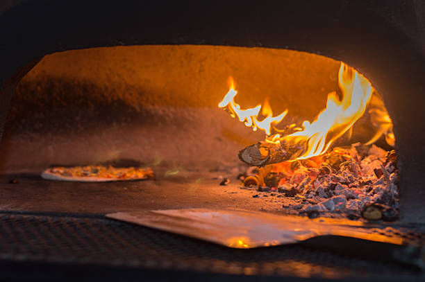 istock Stone Pizza Oven with wood fire and Pizza 480141366