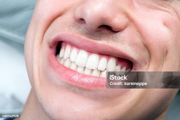 Extreme Close Up Of Human Male Mouth Showing Teeth Stock Photo - Download Image Now
