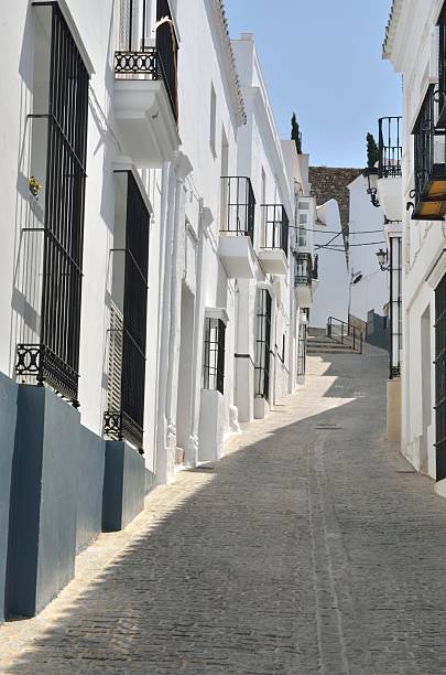 istock Cobblestone street in white town 480143018
