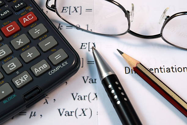 istock Eye Glasses, pen and pencil over the Formula with calculator 480144100