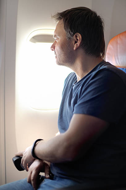 istock Male passenger in the airplane 480144322