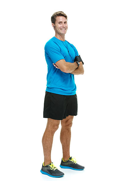 istock Smiling male runner standing with arms crossed 480148336