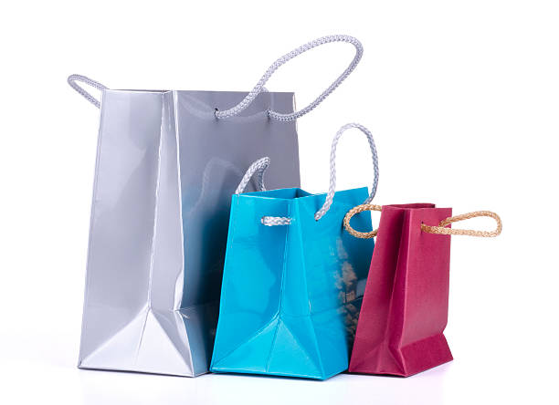 colored shopping bags - silver paper стоковые фото и изображения