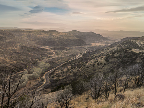 A shot of a winding road from the top of the scenic overlook in the Fort Davis mountains in West Texas near Marfa.