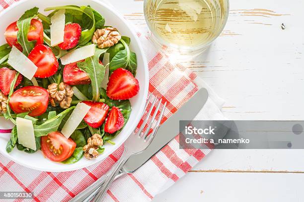 Salad With Baby Spinach Strawberry Nuts Oil Bread Plaid Napkin Stock Photo - Download Image Now