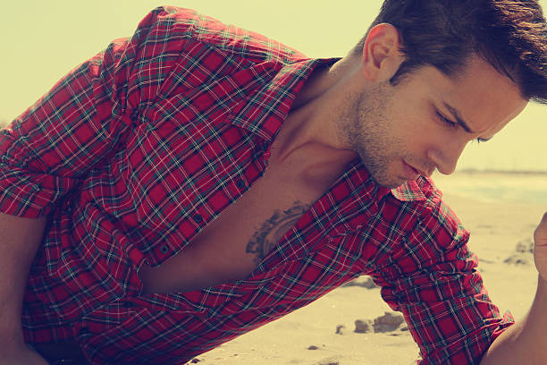 istock male model on the sand 480151226