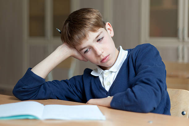 istock Diligent preschool sitting at desk, classroom 480152239