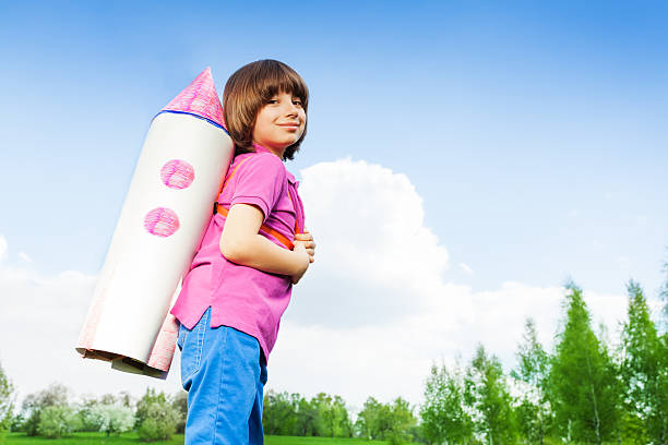 istock Smiling cute boy wearing carton rocket toy 480154494