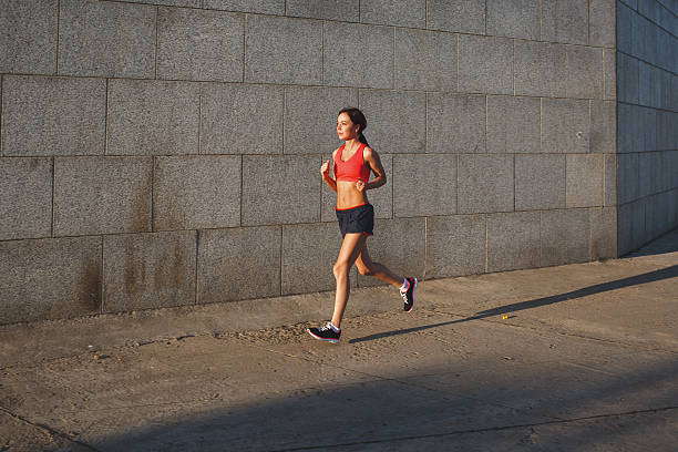 istock woman working out in an urban setting 480155404