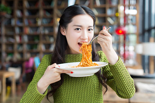 chinese female students demonstrated at the restaurant pasta