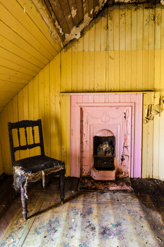 A beautiful pink Victorian fireplace is all that remains in one of the bedrooms of an old, derelict,  house on the Island of Lewis, Outer Hebridies. 