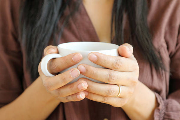 istock coffee cup in woman hand. 480162333