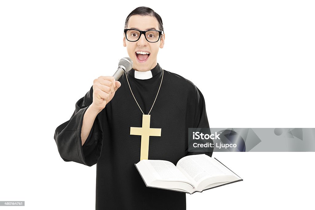 Male priest reading a prayer on microphone Male priest reading a prayer on microphone isolated on white background 20-29 Years Stock Photo