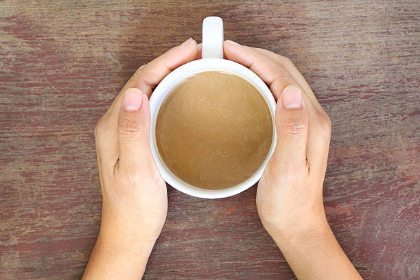 istock Coffee cup in woman hand 480165081