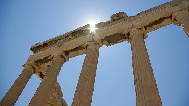 Erechtheion temple in Athens, Acropole, Greece. An ancient’s temple ruins Athens, Acropolis. The Sun shines by a crack. acropole stock pictures, royalty-free photos & images