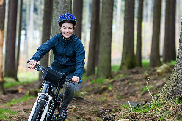 istock Girl riding bike on forest trails 480169179