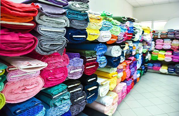 istock Rolls of fabri and textiles in a factpory shop. 480170022