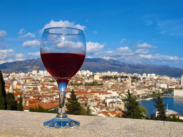 glass of wine on wall Marjan Hill overlooking Split, Croatia stock photo