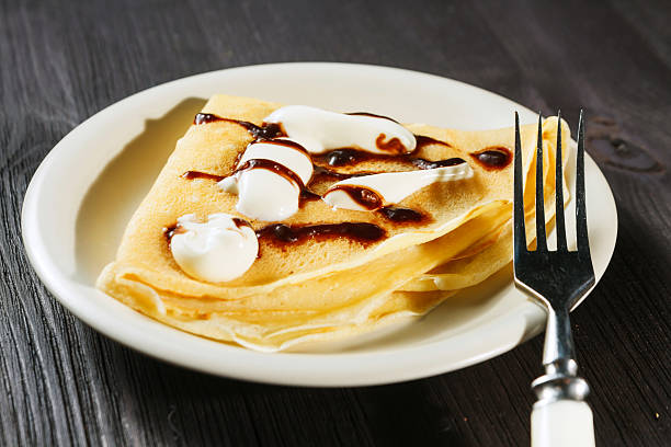 istock Closeup of chocolate pancakes with whipped cream 480177777