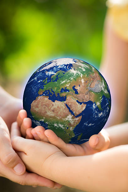 istock Children holding Earth in hands 480178213