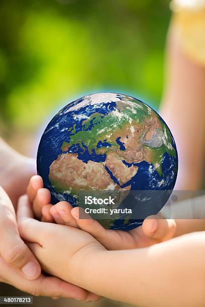 Children Holding Earth In Hands Stock Photo - Download Image Now - Advertisement, Baby - Human Age, Backgrounds