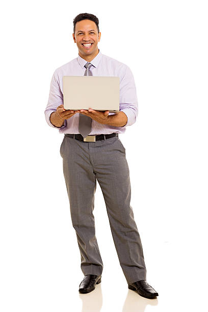 istock middle aged businessman holding laptop 480178670