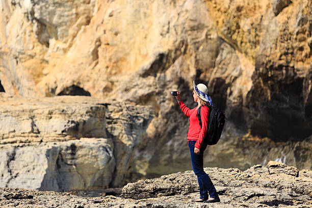 istock tourist making photo of scenic cliffs 480178786