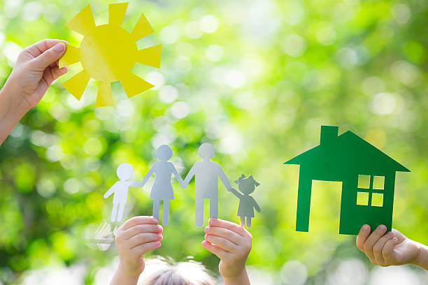 Ecology house in hands stock photo