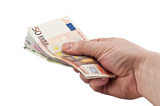 istock Hand giving money isolated on white background 480179554