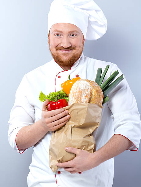 istock Head-cook holding package with fresh food 480182488