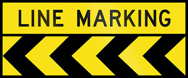 Chevron Alignment To The Left - Line Marking In Australia Australian chevron alignment pointing to the left with the words: Line Marking road chevron warning signs stock pictures, royalty-free photos & images