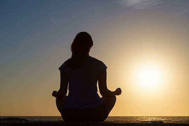 istock Relax in the lotus position against the setting sun 480183058