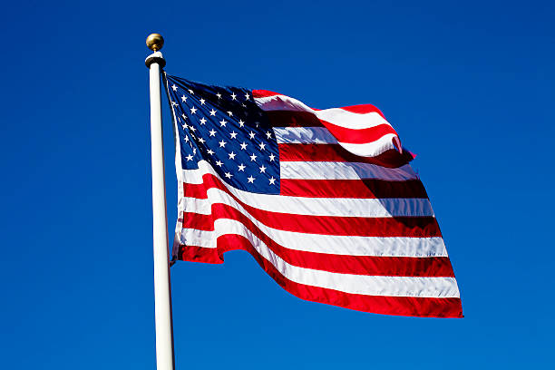 istock United States Flag Flying on Flag Pole 480184749