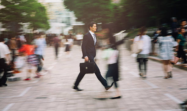 istock Businessman walking quickly on the street 480187776