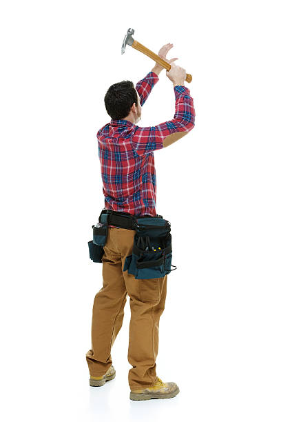 istock Rear view of carpenter working with hammer 480187966