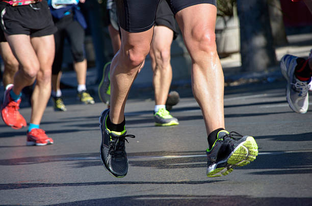 istock Marathon running race, people feet on road 480188157