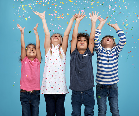 Studio shot of a group of happy young children with confetti falling all around themhttp://195.154.178.81/DATA/i_collage/pu/shoots/805185.jpg