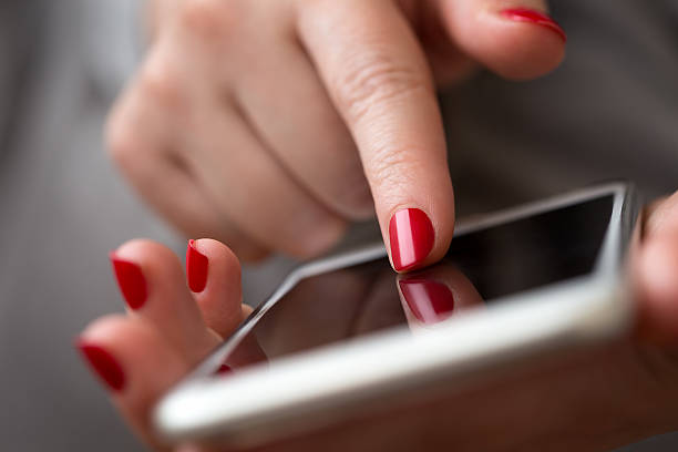 istock Closeup of a woman hand using a smart phone 480190596