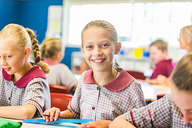 istock Smiling Young School Girl in a Classroom 480190936