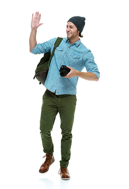 istock Smiling photographer waving hand 480191184