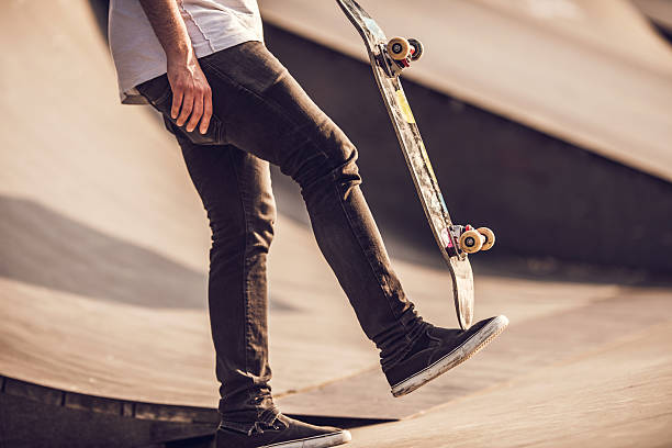 istock Unrecognizable street skateboarder holding skateboard. 480191236