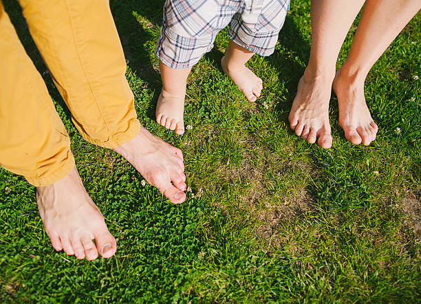 istock Happy family standing on grass in warm summer day 480193574