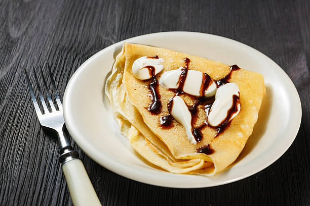 istock Closeup of chocolate pancakes with whipped cream 480193665