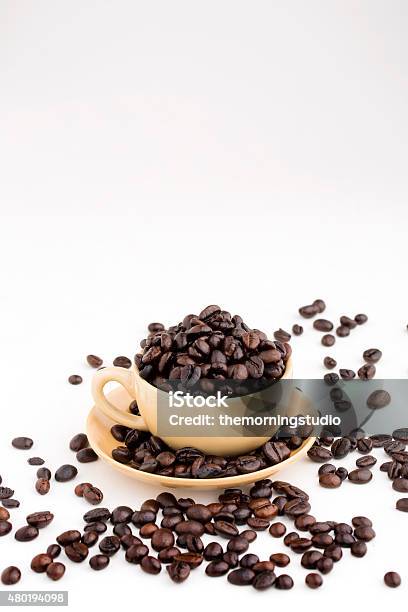 Cup Full Of Coffee Beans On White Background Stock Photo - Download Image Now - 2015, Agriculture, Backgrounds