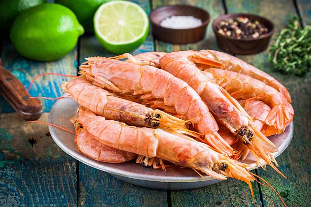 istock fresh raw shrimps in a bowl with salt, pepper, lime 480194246