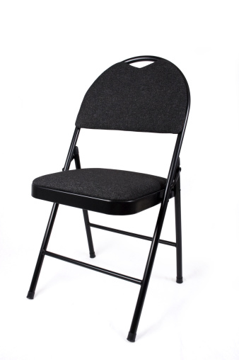 black folding chair, shot on a white background and isolated