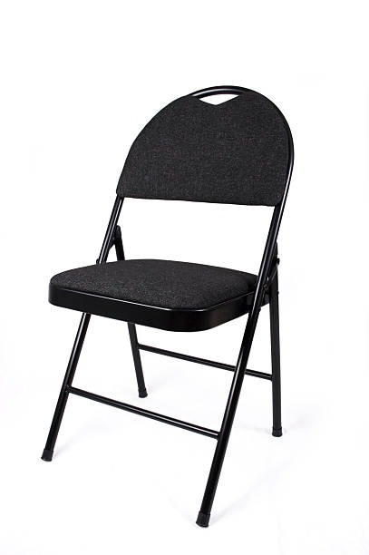 black folding chair 2 black folding chair, shot on a white background and isolated folding chair stock pictures, royalty-free photos & images