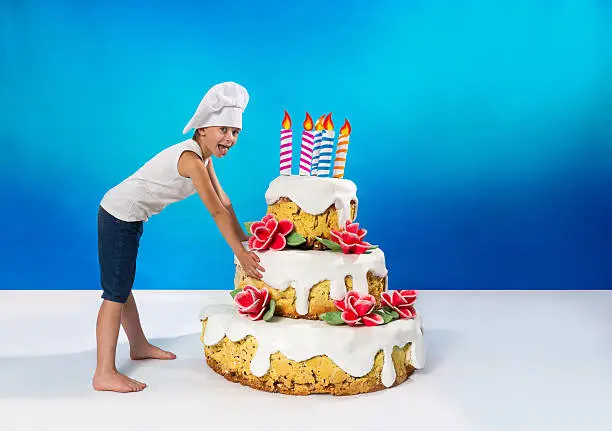 Photo of Little confectioner drags a cake