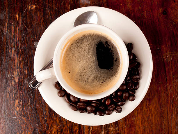 istock Cup of dark roasted coffee with coffeebeans 480196233