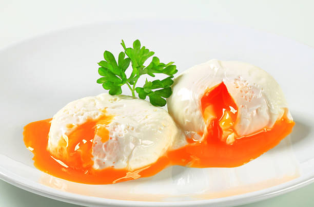 Poached eggs Two poached eggs on plate Poached Eggs stock pictures, royalty-free photos & images